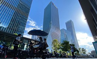 Evergrande gilt als das weltweit am höchsten verschuldete Immobilienunternehmen. - Foto: Ng Han Guan/AP/dpa