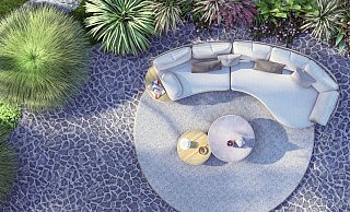 Wie aus einem Guss: Das Outdoorsofa von Zebra fügt sich mit dem Teppich und den beiden Tischen elegant als Einheit zusammen. - Zebra Group/dpa-tmn