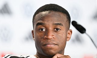 Sieht sich bei der WM in der Rolle des Lernenden: Youssoufa Moukoko. - Federico Gambarini/dpa