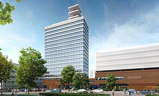 Blick vom Kesselbrink. Das Hochhaus und das benachbarte Parkhaus erhalten mit der Revitalisierung durch Goldbeck eine neue Fassade. - Goldbeck