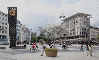 Eine Felsenbirne in einem Kübel: An vier Standorten auf dem Jahnplatz sollen die Gewächse aufgestellt werden. Die Visualisierung vermittelt einen Eibdruck davon, wie das Erscheinungsbild dann sein könnte. - Stadt Bielefeld