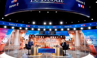 Emmanuel Macron und Marine Le Pen vor der TV-Debatte. - Foto: Ludovic Marin/Pool AFP/AP/dpa