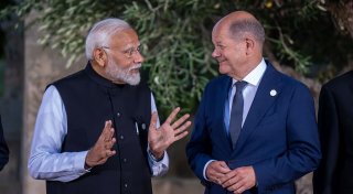 Was der Kanzler und das halbe Kabinett in Indien wollen