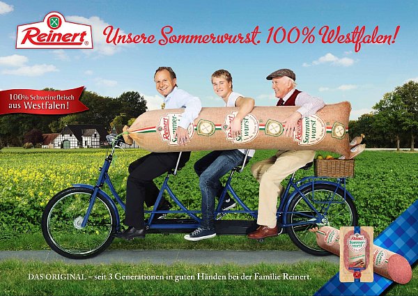 2013 präsentierte Reinert seine Sommerwurst-Kampagne, auf der Firmenchef Hans-Ewald Reinert, Sohn Carl Ewald Reinert und Vater Hans Reinert gemeinsam auf dem Generationen-Fahrrad sitzen. - © Reinert
